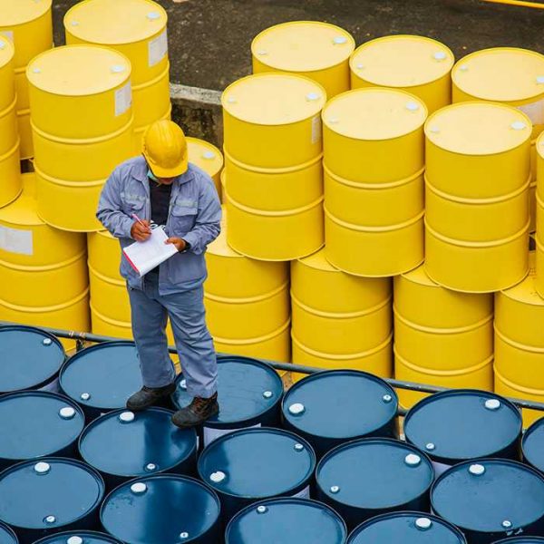 male-worker-inspection-record-drum-oil-stock-barrels-yellow-vertical-chemical-transportation-truck-male-industry_478515-4030